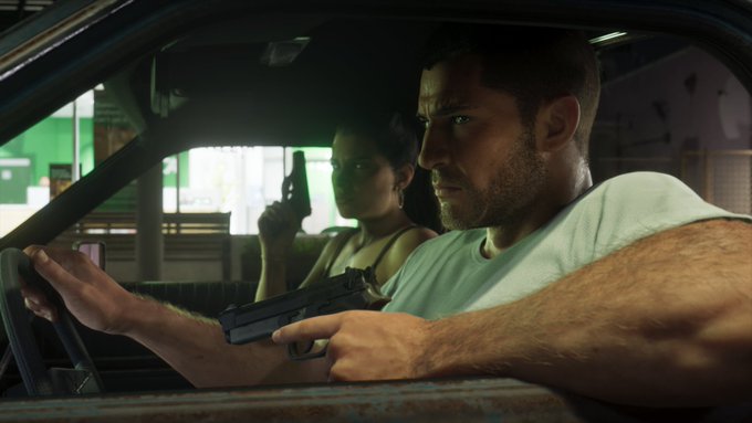 A man driving with a pistol while a woman rides in the back seat.